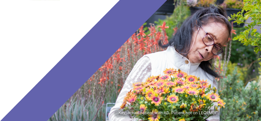 A woman tending flowers in her garden A woman tending flowers in her garden