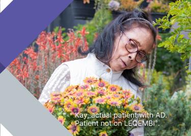 A woman tending flowers in her garden A woman tending flowers in her garden