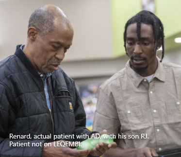 A father with adult son shopping for produce