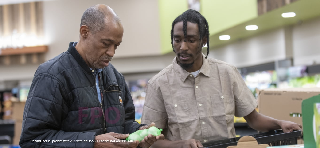 A father with adult son shopping for produce